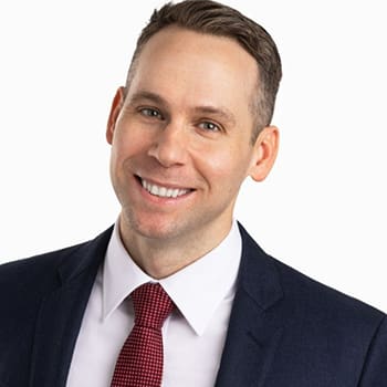 A professional headshot of Robert Anic
