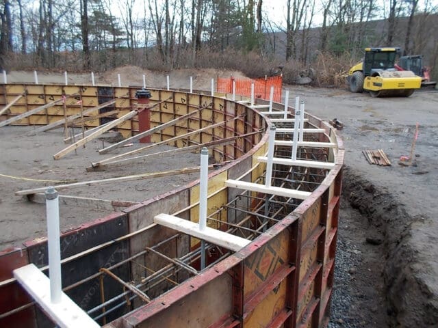A photograph of the foundation of a circular tank being constructed