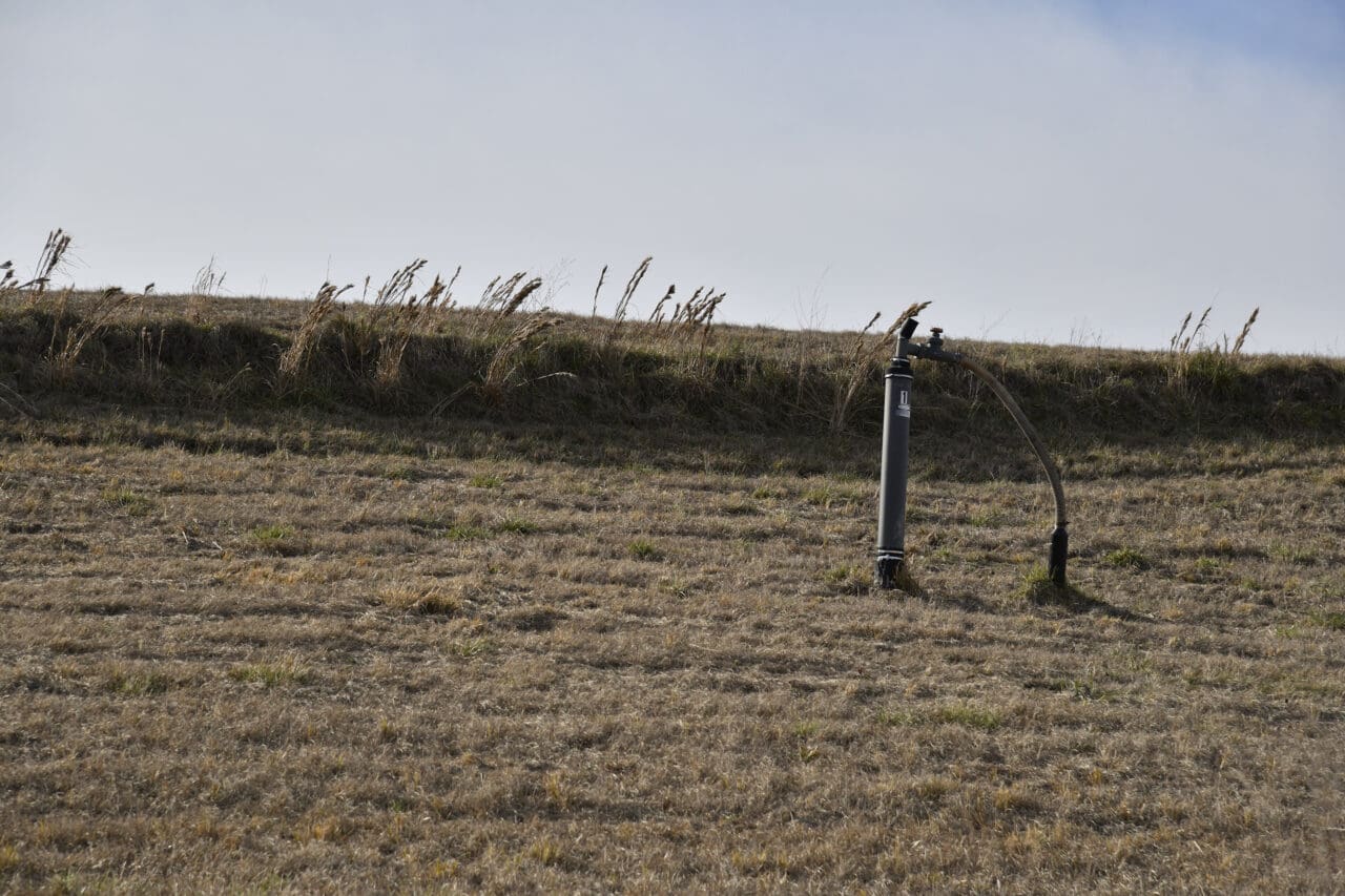 A photograph of a landfill with monitoring equipment
