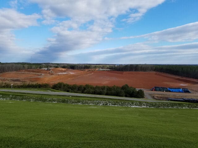 A photograph of two landfills