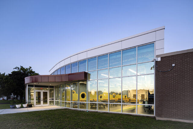 Curved curtain wall exterior facade of a K-12 school building