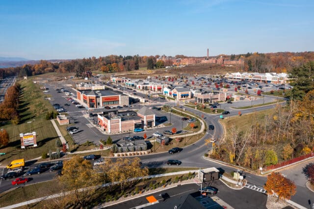 An aerial photograph of a busy entrance into a commercial plaza