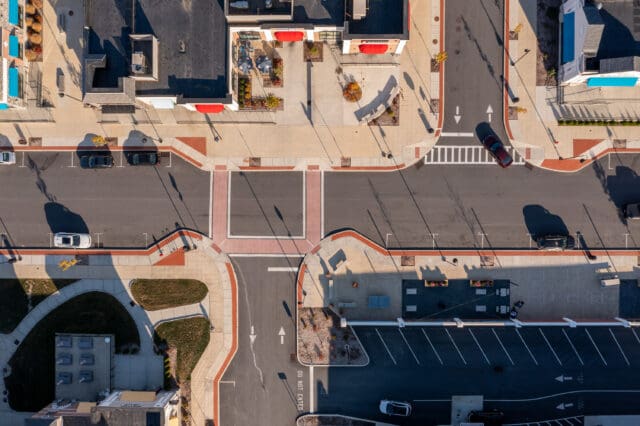 An aerial photograph of parking, sidewalks, crosswalks, and street trees within the Hudson Heritage property
