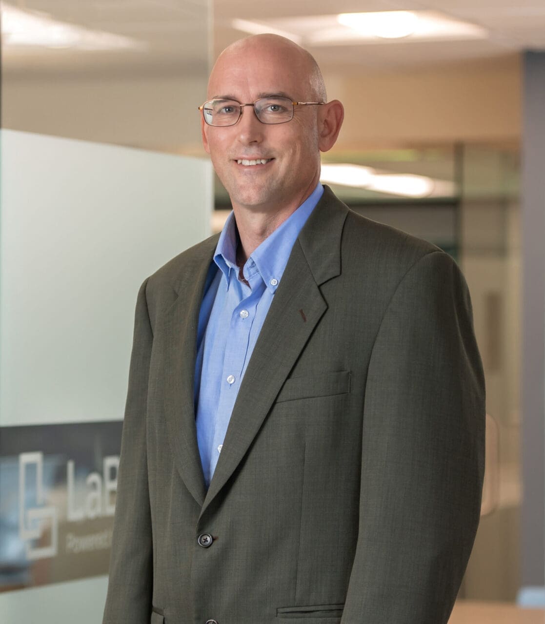 A professional headshot of Andy Rymph