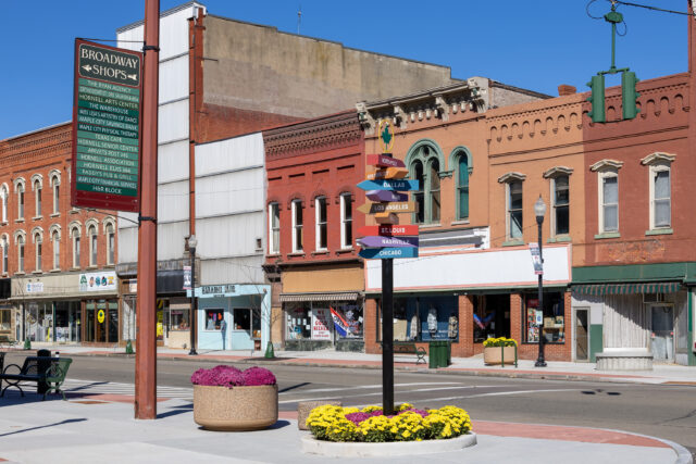 A photo of street plantings and signage in Hornell New York