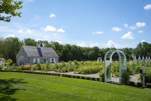 A photograph of a cottage and arbor at Smith Farm Gardens venue in East Haddam, CT