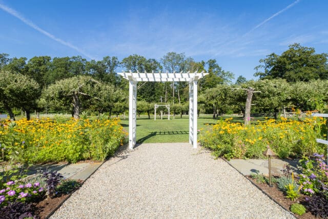 A photograph of an arbor at Smith Farm Gardens venue in East Haddam, CT