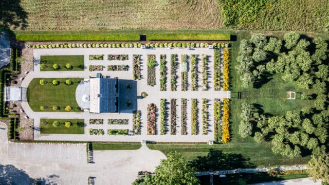 An aerial photograph directly above a cottage at the center of gardens at Smith Farm Gardens venue in East Haddam, CT