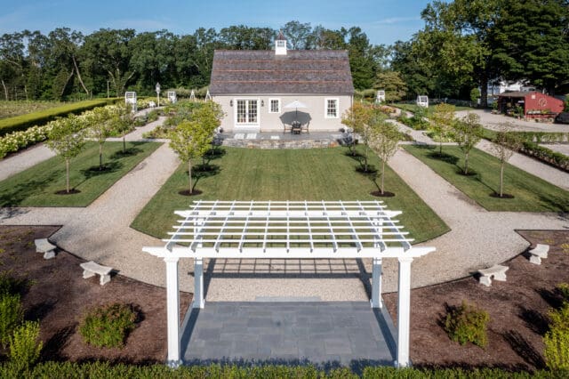 A photograph of a cottage and arbor at Smith Farm Gardens venue in East Haddam, CT