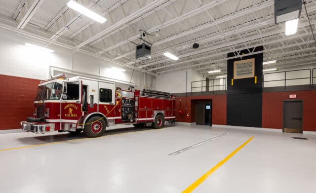 A photograph of a firetruck and training window in the Great Sacandaga Lake Firehouse in Northville, NY