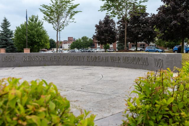 A photograph of a monument at the William C. Chamberlain Riverfront Park which states: 1950 Rensselaer County Korean War Memorial 1953.