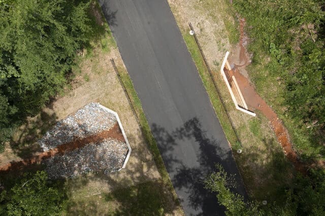 A photograph of newly constructed culverts and weir walls under High Ridge Road