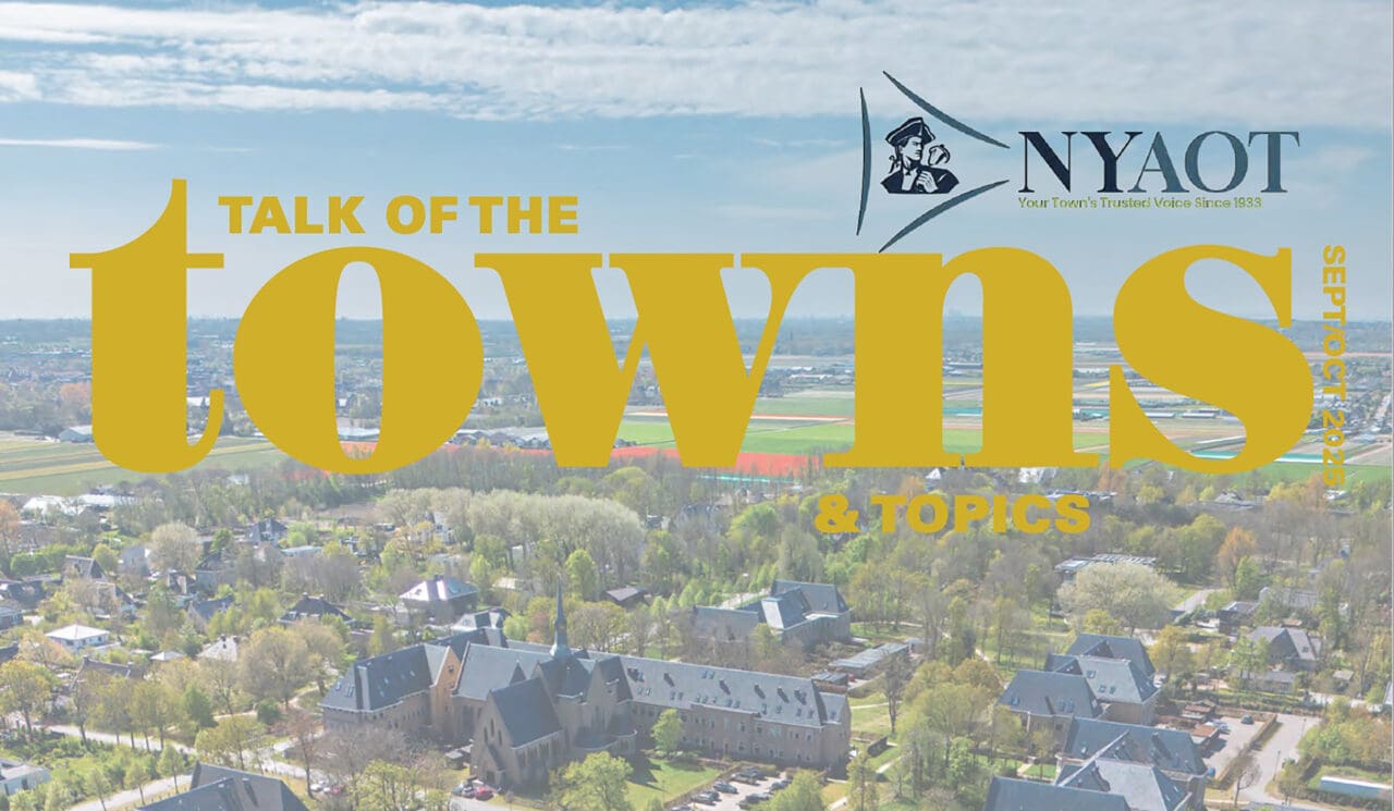 An image of the top of a magazine cover for NYAOT Talk of the Towns with a photograph of a neighborhood in the background