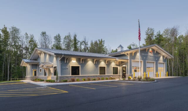 An exterior photograph of a building at dusk.
