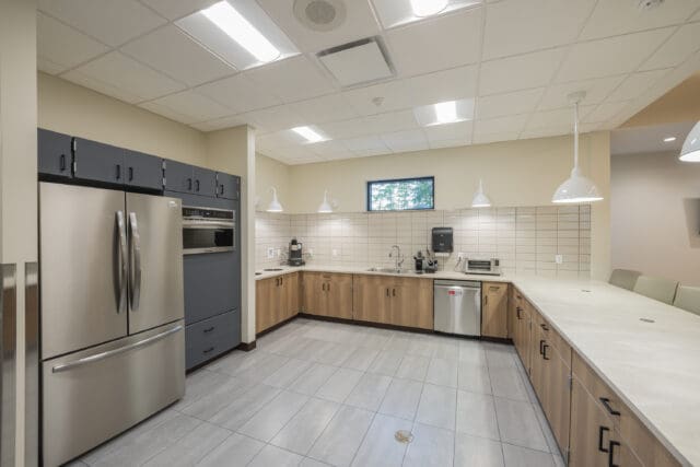 A photograph of a kitchen with an island