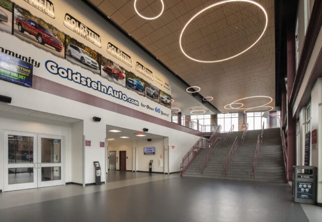 A photograph of the entrance to the M&T Bank Center Arena, including stairs and circular lighting.
