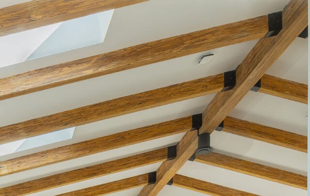 A detail photograph of a wood-truss roof