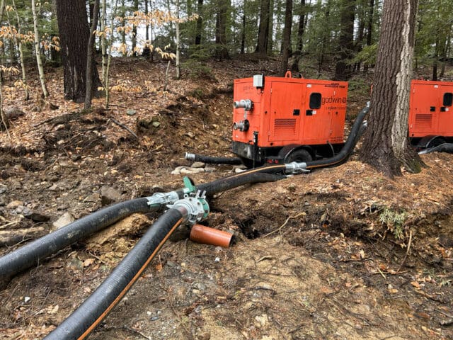 A photograph of a new watermain bypass running through a pump system