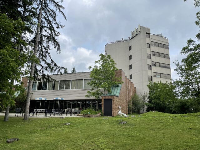 A photograph of a dated exterior of a building in brutalist architectural style