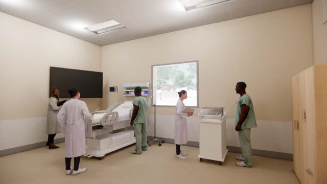 A simulation of five people in a healthcare setting. Three are standing around a hospital bed. Two are standing around a mobile bassinet. There is a television on the wall and a window to the exterior.