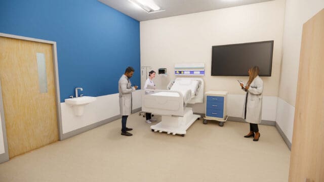 A simulation of three physicians in a room standing around a hospital bed. There is a large television on the wall and a sink near the door.