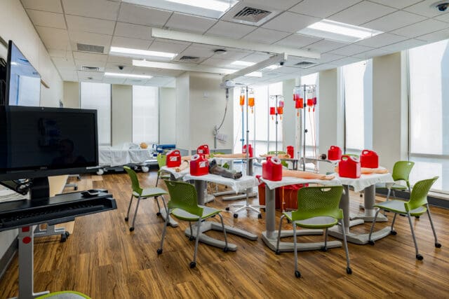 A photograph of multiple phlebotomy stations within a medical setting.