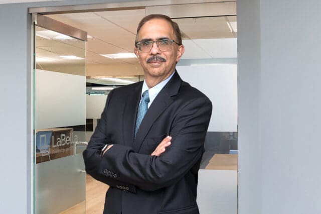 A professional headshot of Ajai Shakar