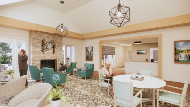 A rendering of a common room with a table and chairs, lounge chairs, and modern decor. A circulation desk is in the background. Three people are using the space.