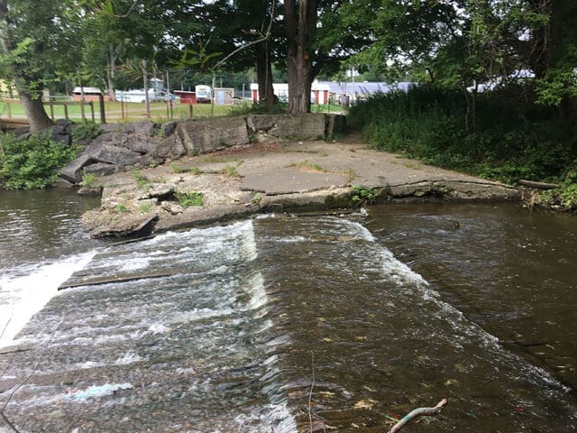 A photograph of Pike Dam along the Wiscoy Creek in Pike, NY