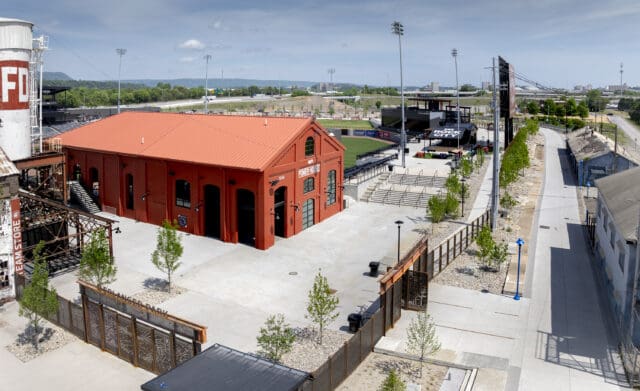 A photograph from the inside of an entrance gate to Erlanger Park, with an emphasis on old, repurposed structures.