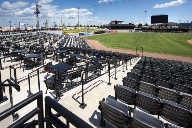 A photograph from the perspective of the stands looking out at a baseball field.