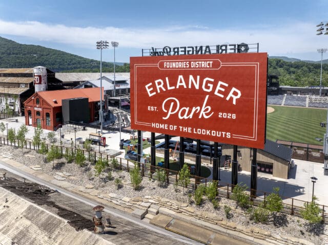 A photograph of a large sign in front of a baseball stadium. The sign says Erlanger Park