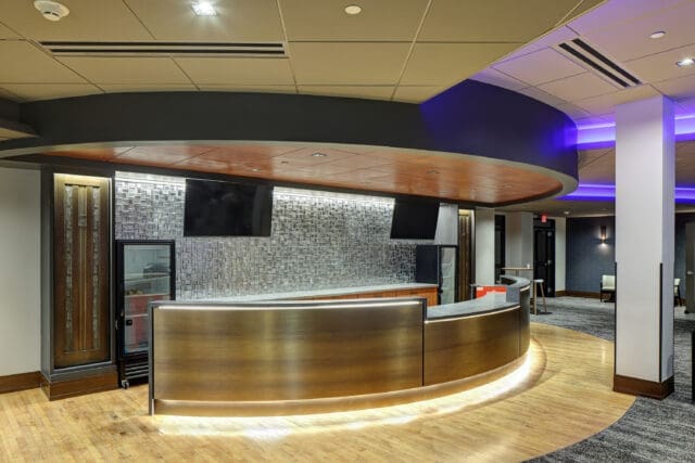 A photograph of a rounded circulation/main lobby desk.