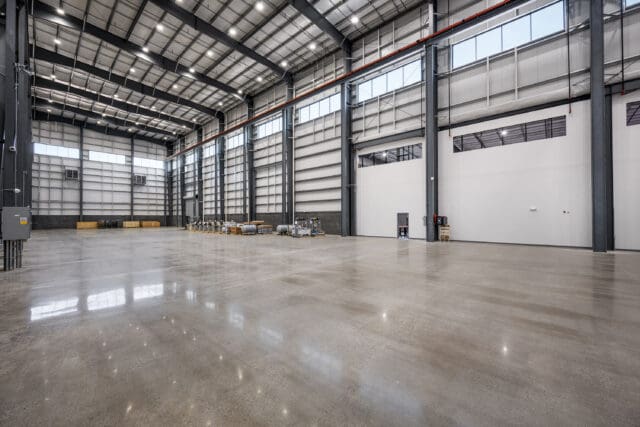 A photograph of a large. empty warehouse